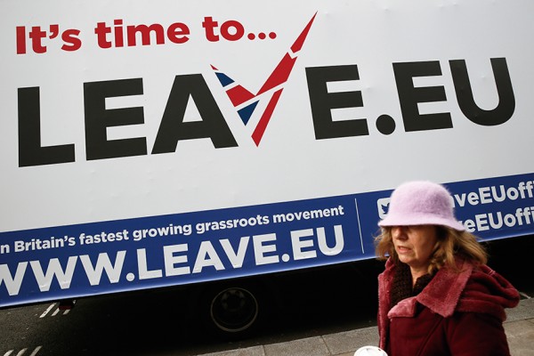A woman walks past a Leave.EU campaign mobile advertising board in central London, Britain November 18, 2015. REUTERS/Stefan Wermuth - RTS7R20
